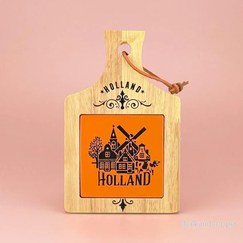 Camp Ostbricka i trä med orange keramikkakel – Holland-design